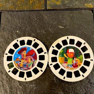 Two view master slides, TOY STORY and handy manny
